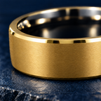 The Keystone gold and black tungsten ring, close-up of the brushed finish and bevelled edge