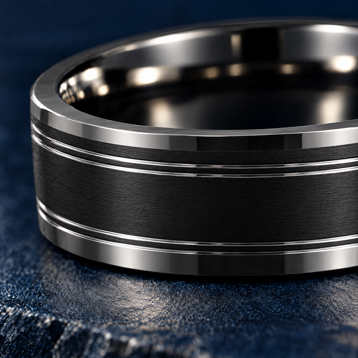 The Twinline black tungsten ring, close-up of the polished grooves and bevelled edge