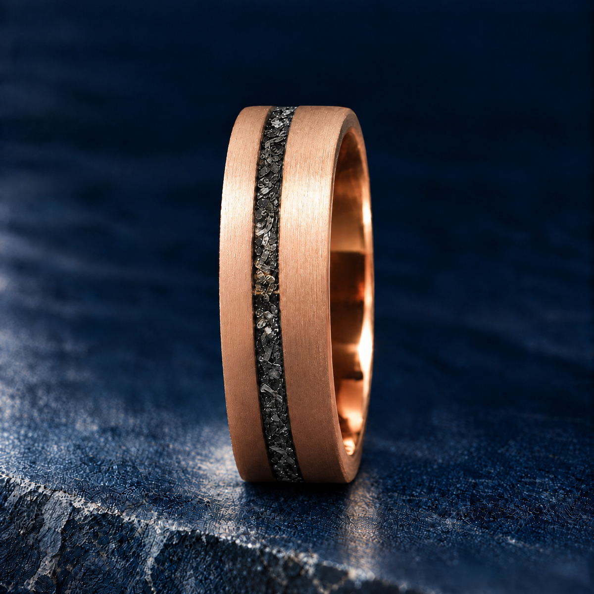 The Starfall rose gold tungsten ring with meteorite inlay, upright side view