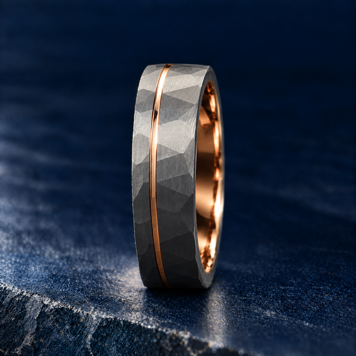 The Forge silver tungsten ring with rose gold accent, upright side view
