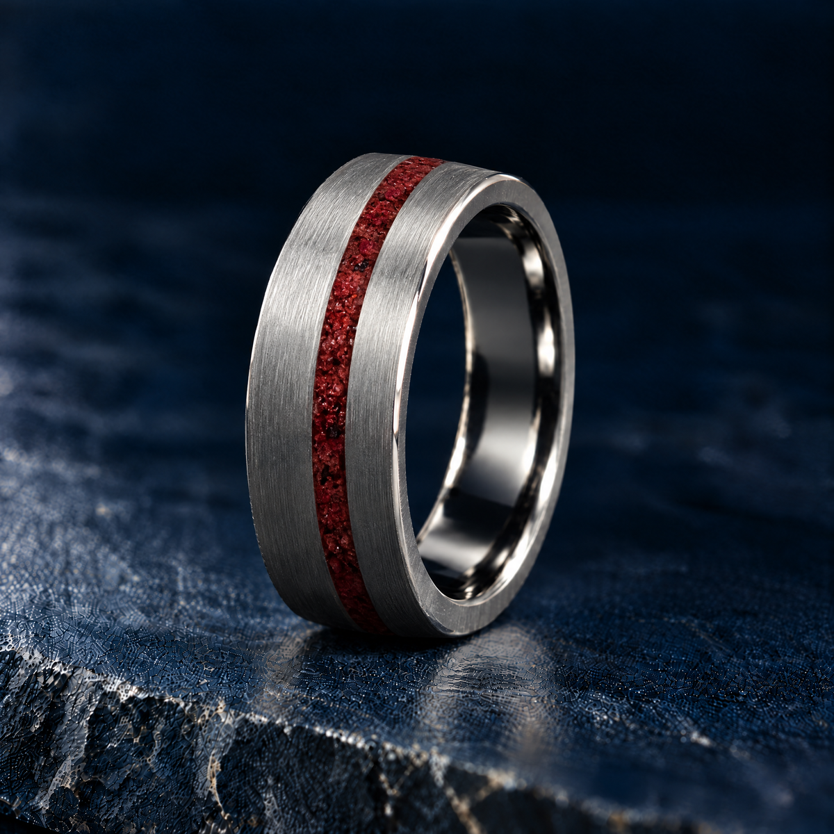 The Moab brushed titanium ring with red rock inlay, angled view