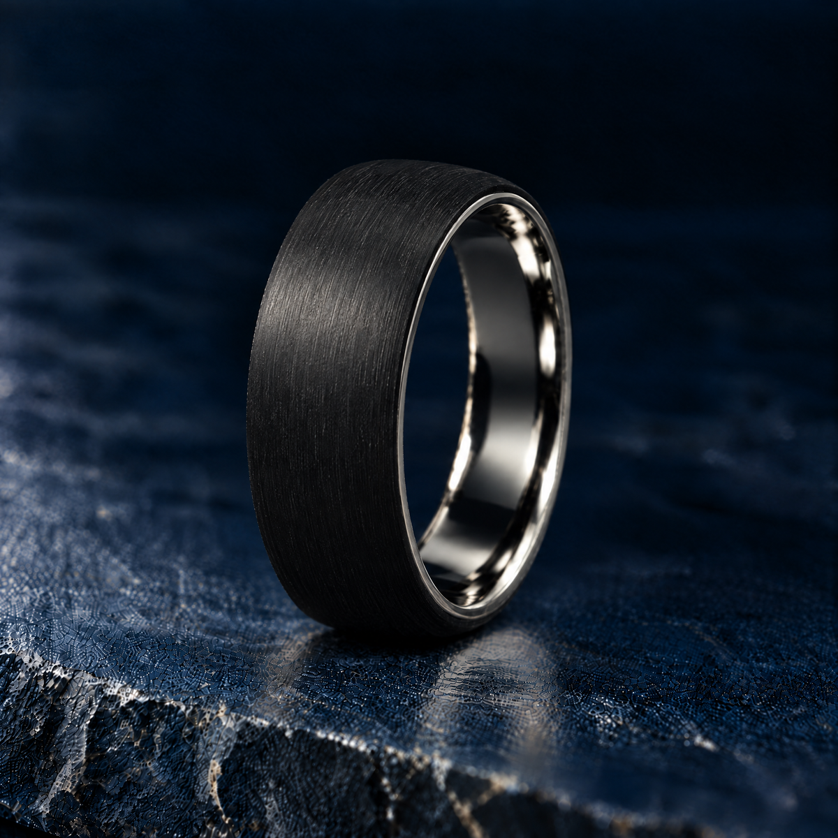The Monaco titanium and carbon fibre ring, angled view