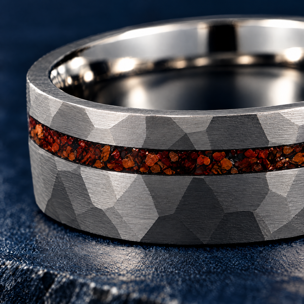 The Lyme silver tungsten ring, close-up of the hammered facets and bone-effect inlay