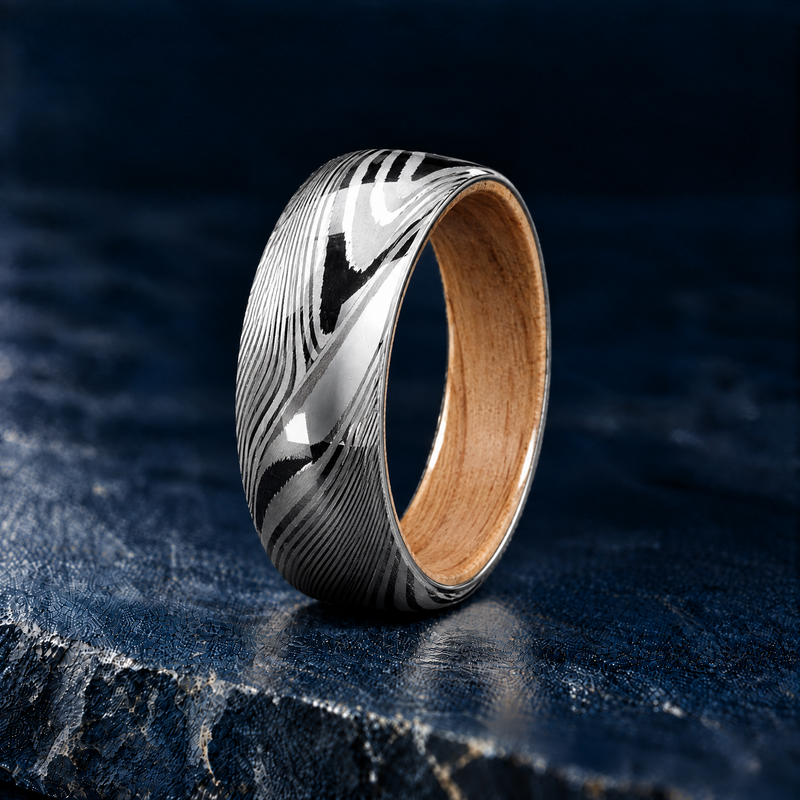 The Grove Damascus steel ring with oak wood lining, angled view