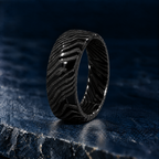 The Orion black Damascus steel ring, angled view