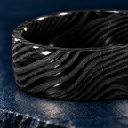 The Orion ring, close-up of the black Damascus relief
