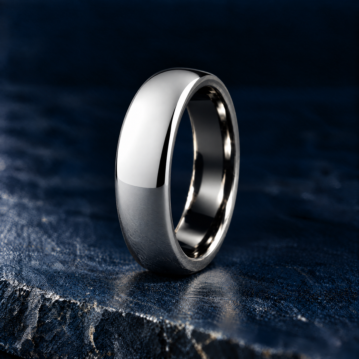The Sovereign polished silver tungsten ring, domed court profile, angled view